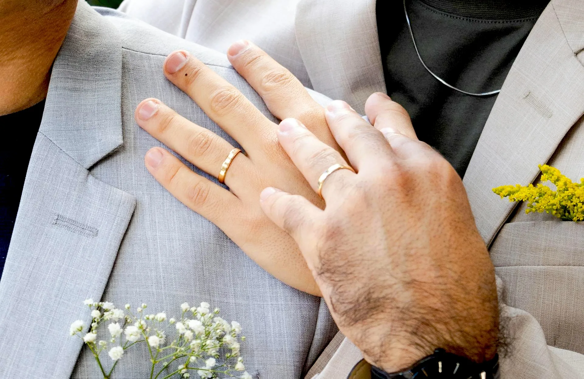 grooms holding hands