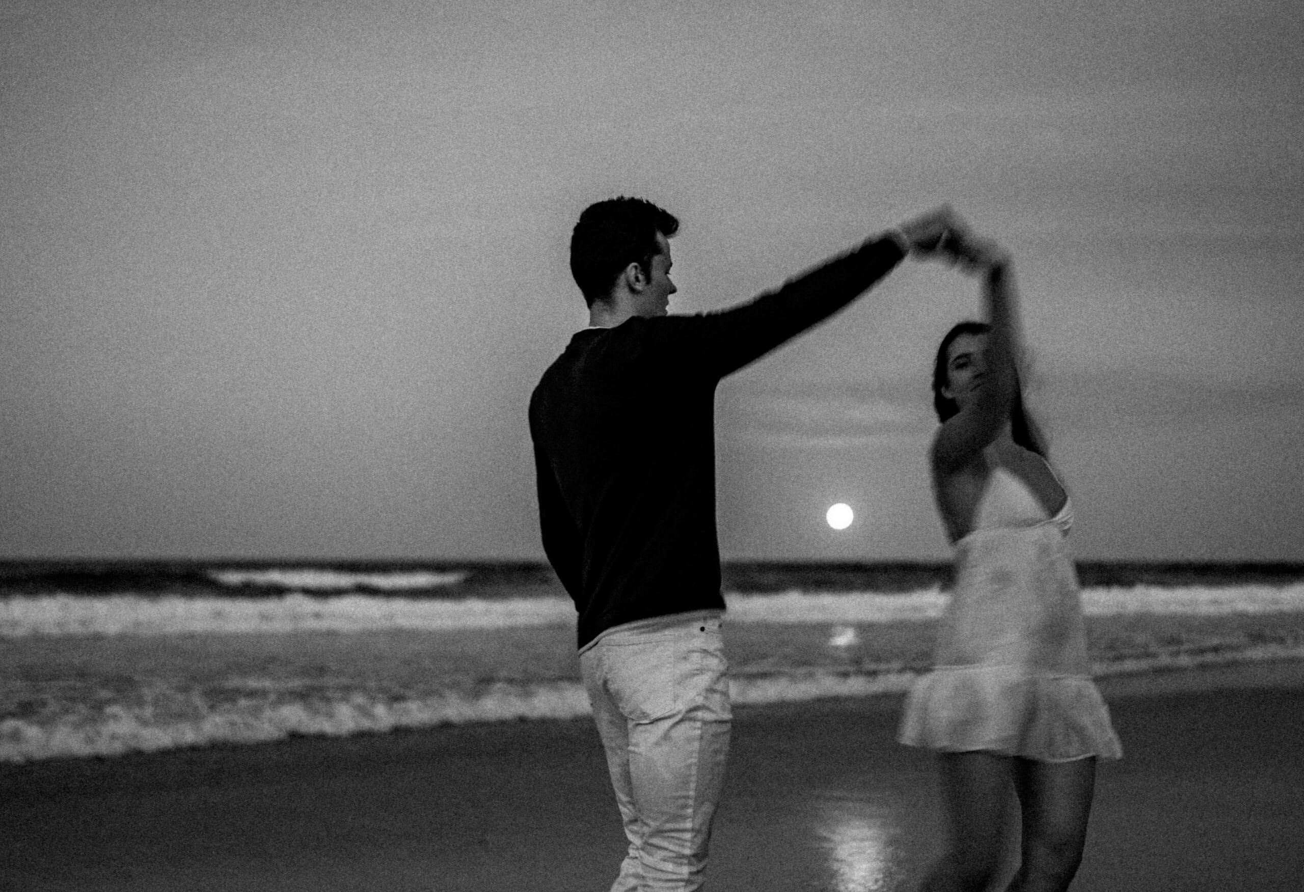 couple by the sea in b&w